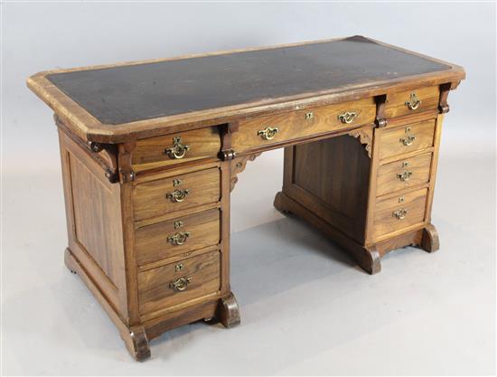 Attributed to Gillows. A Victorian gothic revival rosewood pedestal desk, W.4ft 8in. D.2ft 2in. H.2ft 5.5in.